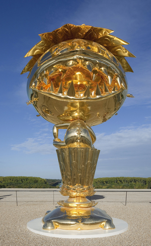 The Oval Buddha Gold artwork by Takashi Murakami a Versailles Oval Buddha Gold - Garden Parterre d'Eau - Gardens du Chateau de Versailles