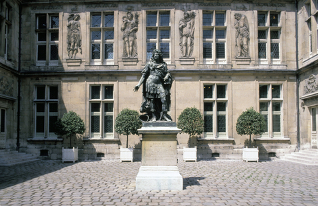 Statue of Louis XIV by Antoine de Coysevox in the courtyard of the Musee Carnavalet, 23 rue de Sevigne, Paris 75003. Architecture by Nicolas Dupuis in 1560 and refurbished in 1660 by Francois Mansart