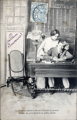 A couple in love, the man writes a letter to his work table. Postcard from the beginning of the 20th century.