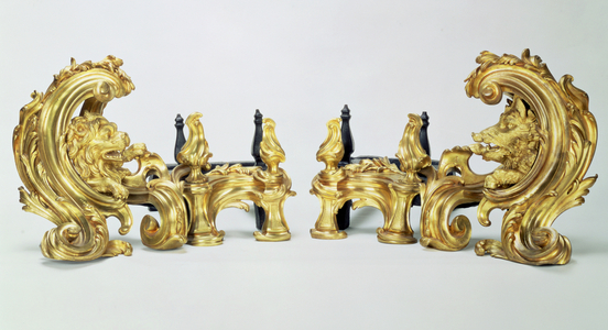 F107/8 Pair of Louis XV Fire-Dogs, of gilt bronze in the form of a heavy acanthus scroll enclosing the forepart of a lion and a boar