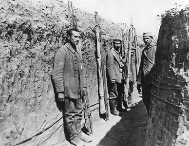 Estrees, France: c. 1916
German prisoners of war waiting with stretchers for the transport of their own wounded.
