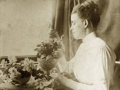 Arranging flowers for a painting, c.1895