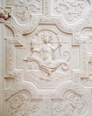 A figure representing female beauty riding a dragon, from the ceiling in the Long Gallery (plaster)