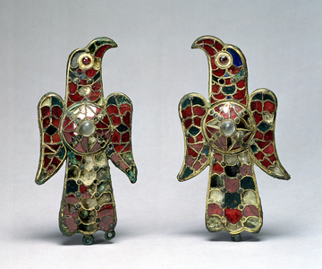 Two eagle-shaped fibulae, discovered in a Cemetery in the Province of Badajoz, Spain, 6th century (gilt bronze, garnets and rock crystal)