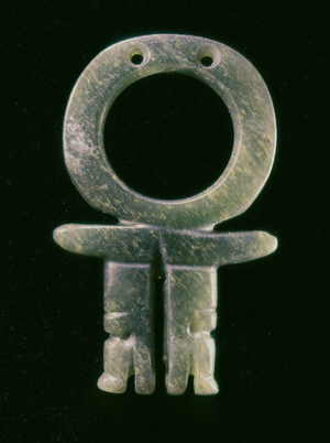 Circular pendant with two alligator heads, from Guacimo, Linea Vieja area (medium green jade)