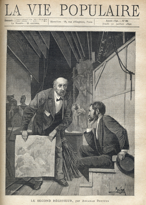 Behind the stage of a theatre, crowded with props and sets, the actors coming out of the stage, a man between two ages addresses a young man sitting, thoughtful, while waving a sheet of sheet, in order to make it vibrate to produce the sound of the storm. Illustration by Alfons Maria Mucha (Alphonse Marie Mucha, 1860-1939), for The Second Regisseur by Abraham Dreyfus (?). Engraving by Fortune Meaulle (1844-1901), 1890. Engraving in “La vie populaire””, 1890. Private Collection