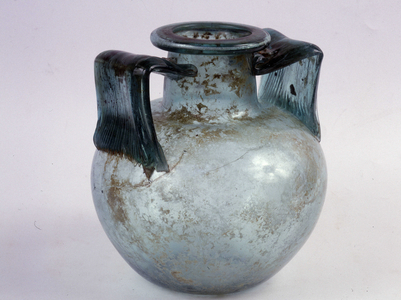 Blue glass cinerary urn with striated handles.