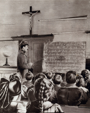 First World War (1914-1918): the new teacher of the city of Uberkumen, Alsace, doing his class in uniform and replacing German teachers.