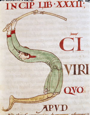 Ms 173 fol.148r Historiated initial 'S' depicting a man threshing, from Moralia in Job by Pope Gregory the Great (vellum)