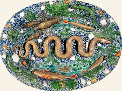Large oval dish moulded in relief with reptiles and fish, 16th century (earthenware)