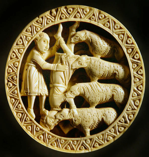 A draughts piece showing an enemy thrown to wild animals (walrus ivory)
