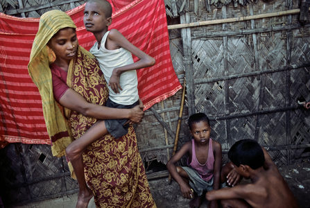 Bangladeshi Mother Carrying Son with Polio on Her Hip, 2002 (photo)