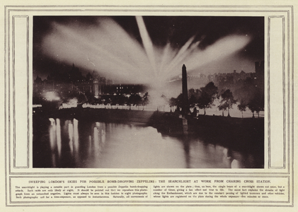 Sweeping London's skies for possible bomb-dropping Zeppelins, the searchlight at work from Charing Cross Station (b/w photo)