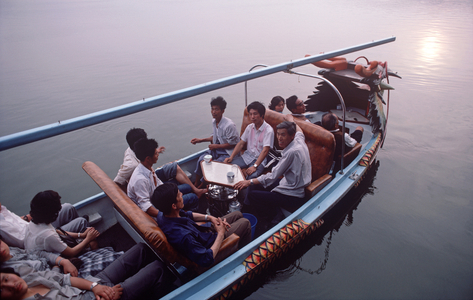 Chinese tourists settling down in tourist boat on West Lake, Hangzhou, Zhejiang Province, China (photo)