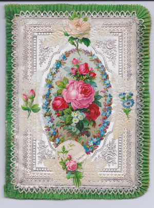 A Victorian decoupage embosed paper lace greeting card with a pleated silk border of a bouquet of flowers surrounded by a wreath of forget-me-nots, c.1880 (colour litho)