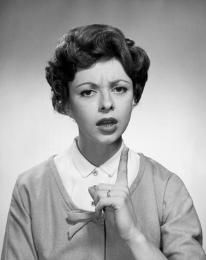 Portrait of a young woman scolding someone