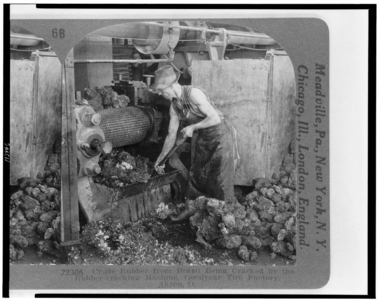 Crude rubber from Brazil being cracked by the rubber-cracking machine, Goodyear Tire Factory, Akron, Ohio, 1928 (b/w photo)