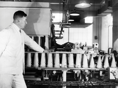 Making Paper Milk Containers (b/w photo)