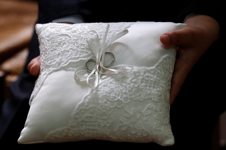 Wedding ceremony in a catholic church, Wedding rings, France, 2019 (photo)