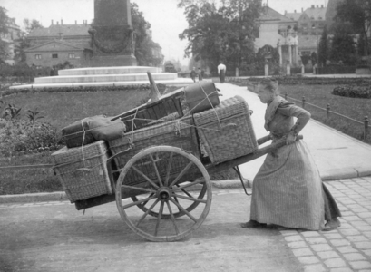 Female luggage carrier, 1911 (b/w photo)