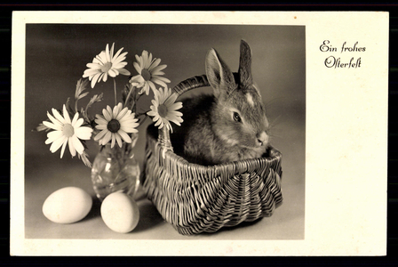 Happy Easter: Easter bunny in basket with eggs and flowers, 1943 (litho)
