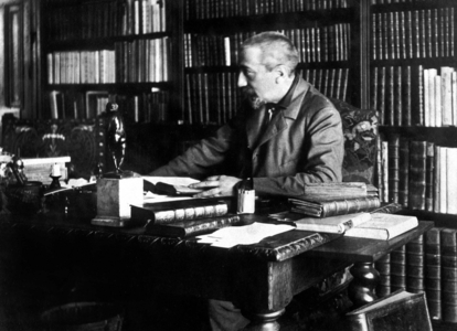 French writer Anatole France (1844-1924) here at his desk c. 1914