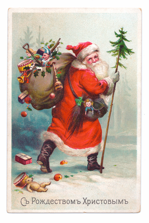 Edwardian postcard of Father Christmas walking through the snow with a large sack of toys on his shoulder, c.1910 (colour litho)
