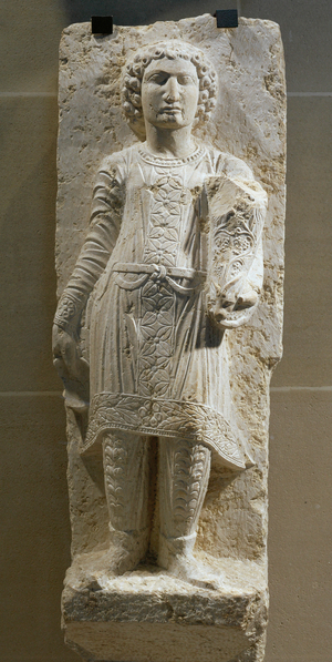 Young man in a Parthian costume, holding a rhyton …