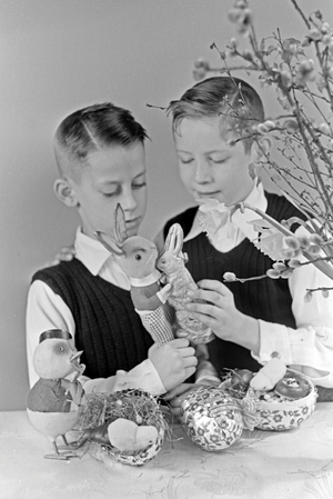 Two boys at a table with easter decoration, Germany 1930s (b/w photo)