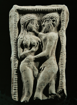 Couple embracing in a votive bed …