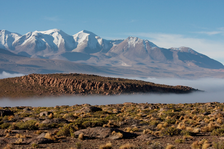 Aucanquilcha Volcano & Salar De Alconcha Salt Pan Covered By Fog (photo)