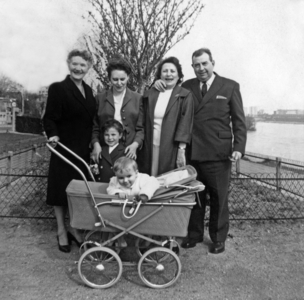 Family photo with children (a baby in a baby carriage), 50's
