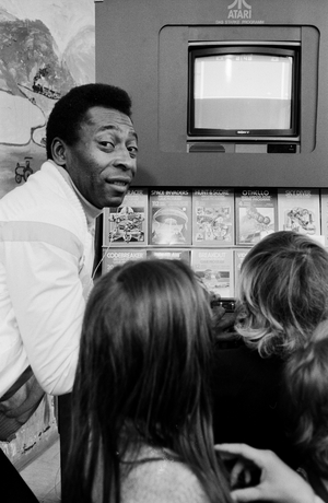 Brazilian football player Pele visiting a childrens hospital and donating a computer and games at Hamburg, Germany 1981
