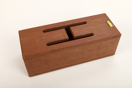 Wooden 2 tone Tongue slit or log drum with different pitches produced by different sized and shaped tongues (photo)