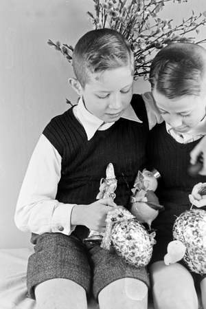 Two boys at a table with easter decoration, Germany 1930s (b/w photo)