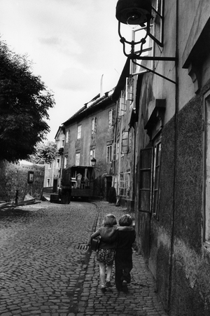 Going home from school in one of the old streets of Malostranska, the Small Side district of Prague …, 1956 (photo)