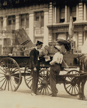 Messenger boys in conversation at Union Square, New York, 1910 (b/w photo)