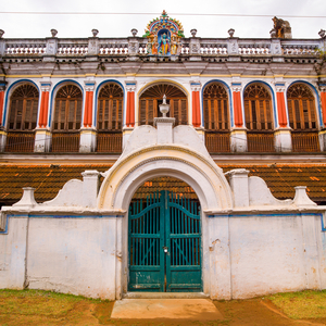 Padlocked Portal At The Entrance Of A Colorful Chettiar Mansion With Religious Carvings On The Top, Kanadukathan Chettinad, India, 2008 (photo)