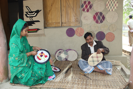 The making of traditional bamboo handicrafts, near the Folk Art and Crafts museum, in Sonargaon, Dhaka, Bangladesh. February 3, 2007.  (photo)