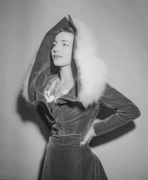 Worth fashion, Paris, December 6, 1950 : coat with a hood trimmed with fur (b/w photo)
