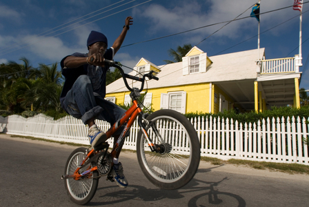 Child in a bicycle and loyalist home, Bahamas (photo)