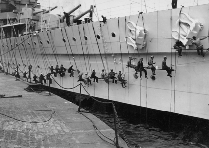 Painting the Sides of HMS Cumberland, c.1930 (b/w photo)