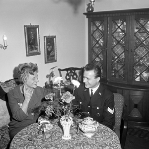 German actress, cabaret artist, singer and author Gerty Molzen drinking coffee with a navy soldier at Hamburg, Germany mid 1960s