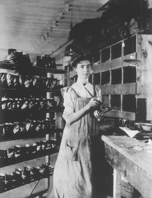 Woman working in a shoe factory, c.1895 (b/w photo)