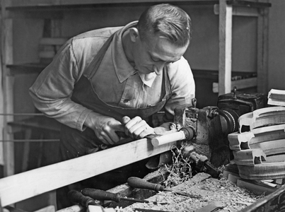 Carpenter in his workshop, 1936 (b/w photo)