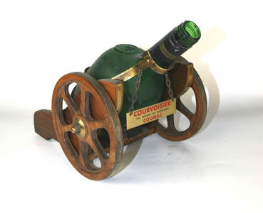 Courvoisier cognac bottle display in the shape of a cannon around 1965