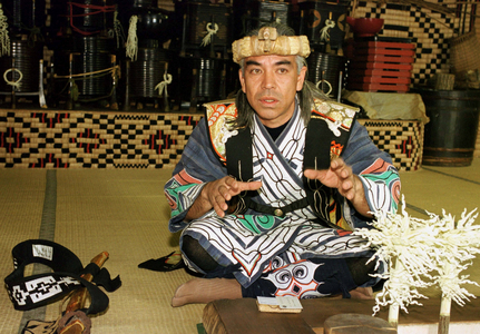 Ainu man in traditional dress at the Ainu Museum in Shiraoi on Hokkaido, 1999 (photo)