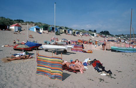 Sunbathing at Abersoch beach on Bank Holiday, LLyn peninsula, Gwynedd, North Wales, 1983 (photo)