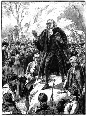 John Wesley (1703-1791) English non-conformist preacher. Founder of  Methodism. Wesley preaching in the open air Cornwall, England. Woodcut 1888.