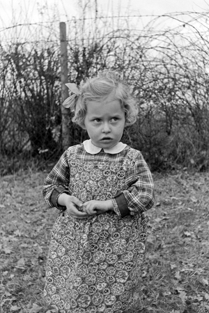 One of Knipser's quadruplet girls playing at the garden, Germany 1930s (b/w photo)